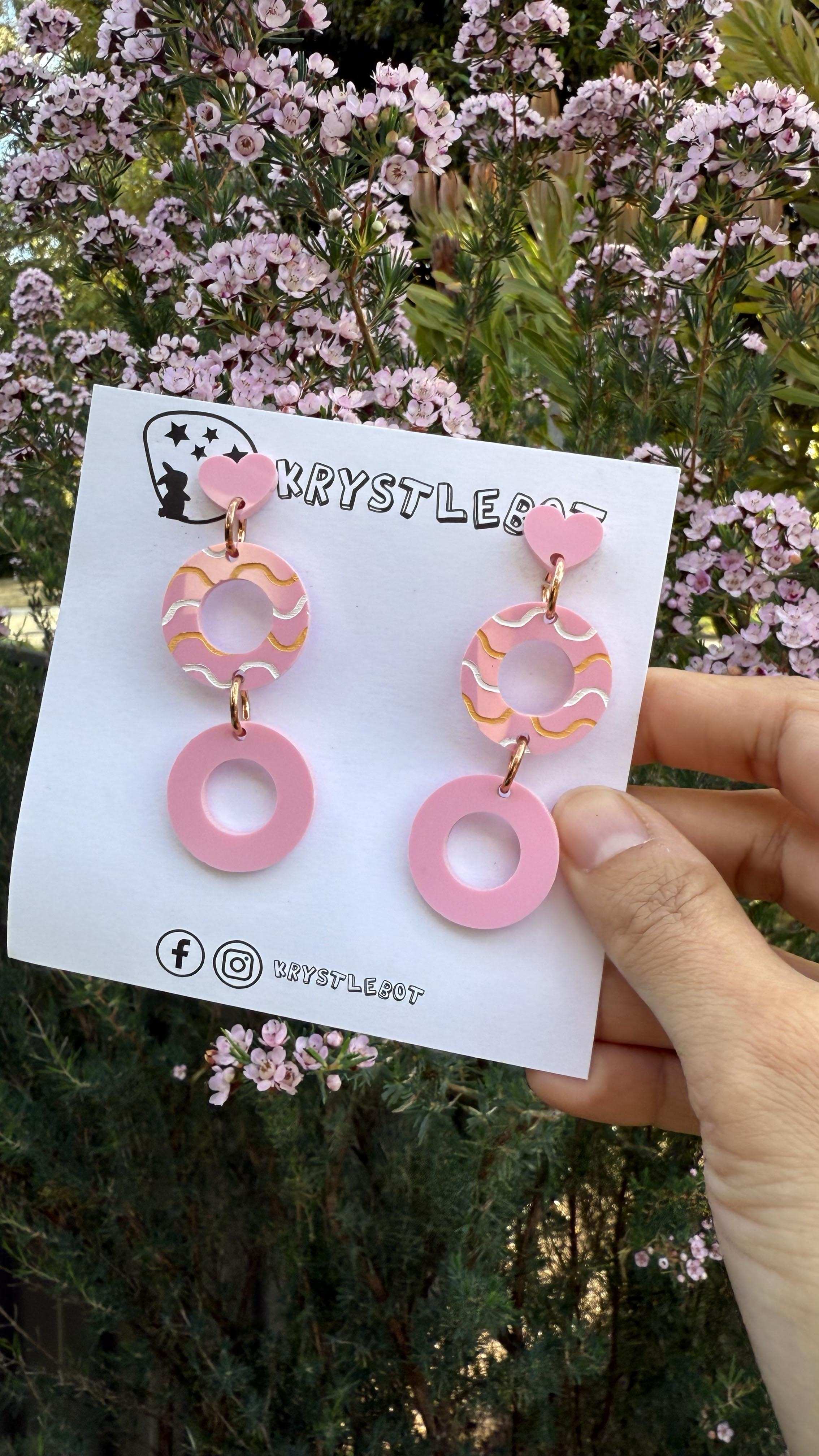 Pink Circle Statement One-of-a-kind Dangle Earrings with a light pink centre hand painted with a white and orange wave pattern.