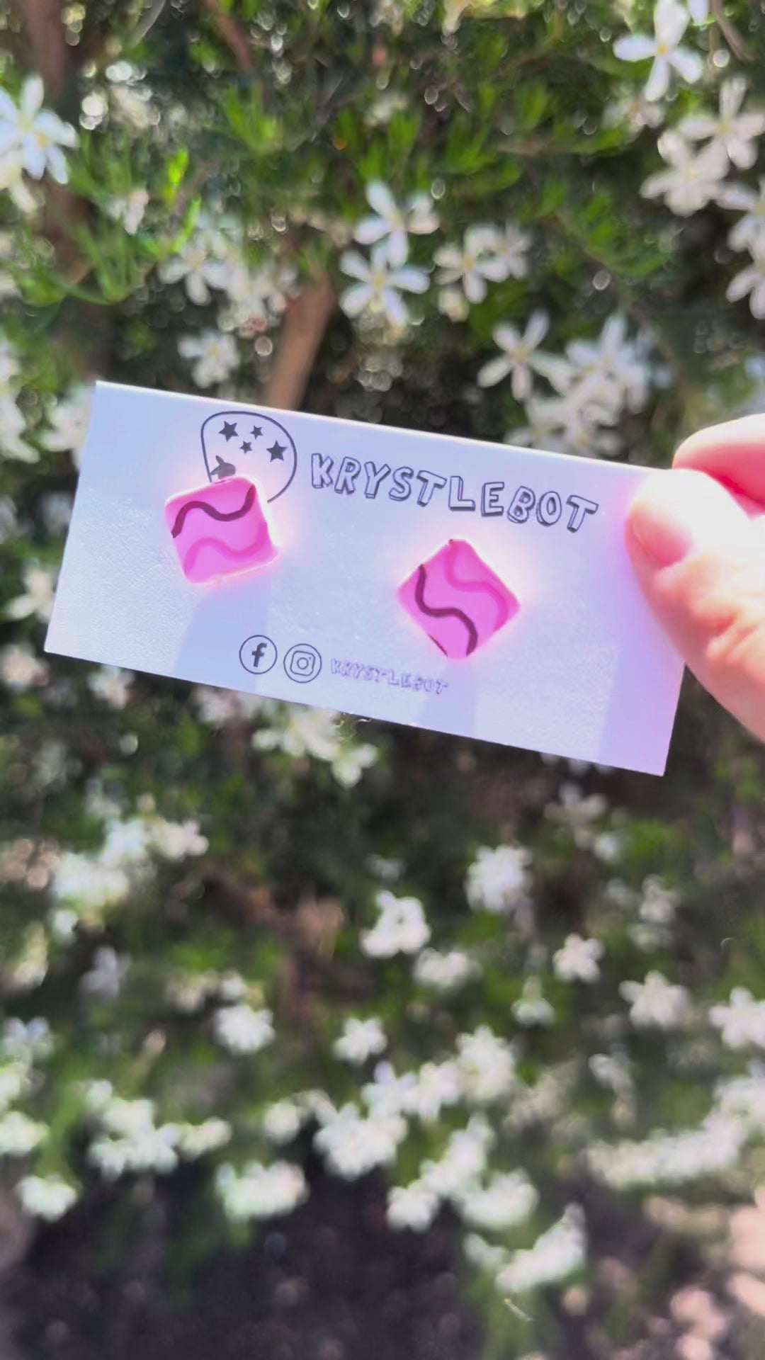 Video showing pink and purple hand painted wave square shaped studs
